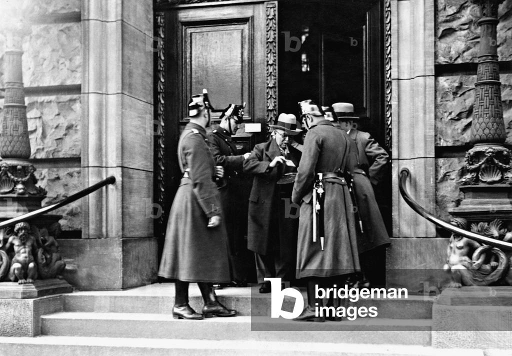 Policemen control members of the parliament, 1932 (b/w photo)