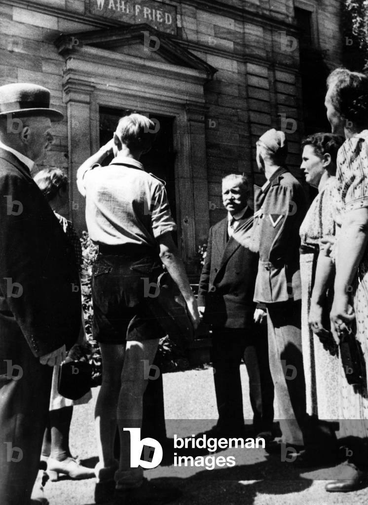 Guests of Adolf Hitler receive a guided tour of Bayreuth, 1941 (b/w photo)