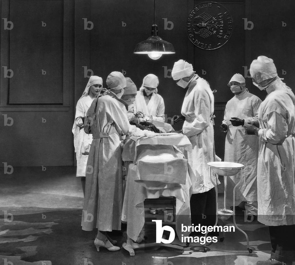 Team of doctors in an operation (b/w photo)