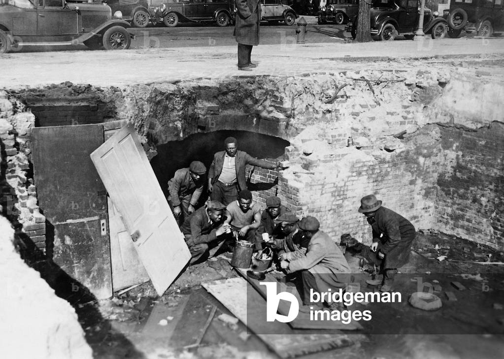 Unemployed during the Great Depression in a cellar dwelling (b/w photo)