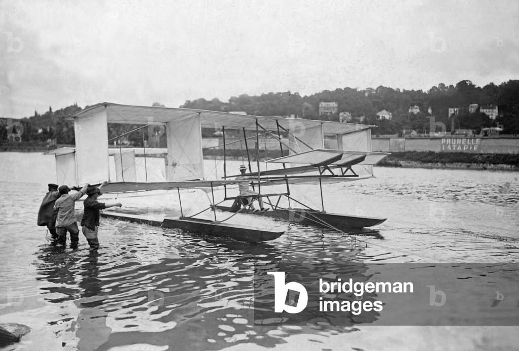 Biplane on the Seine, 1906 (b/w photo)