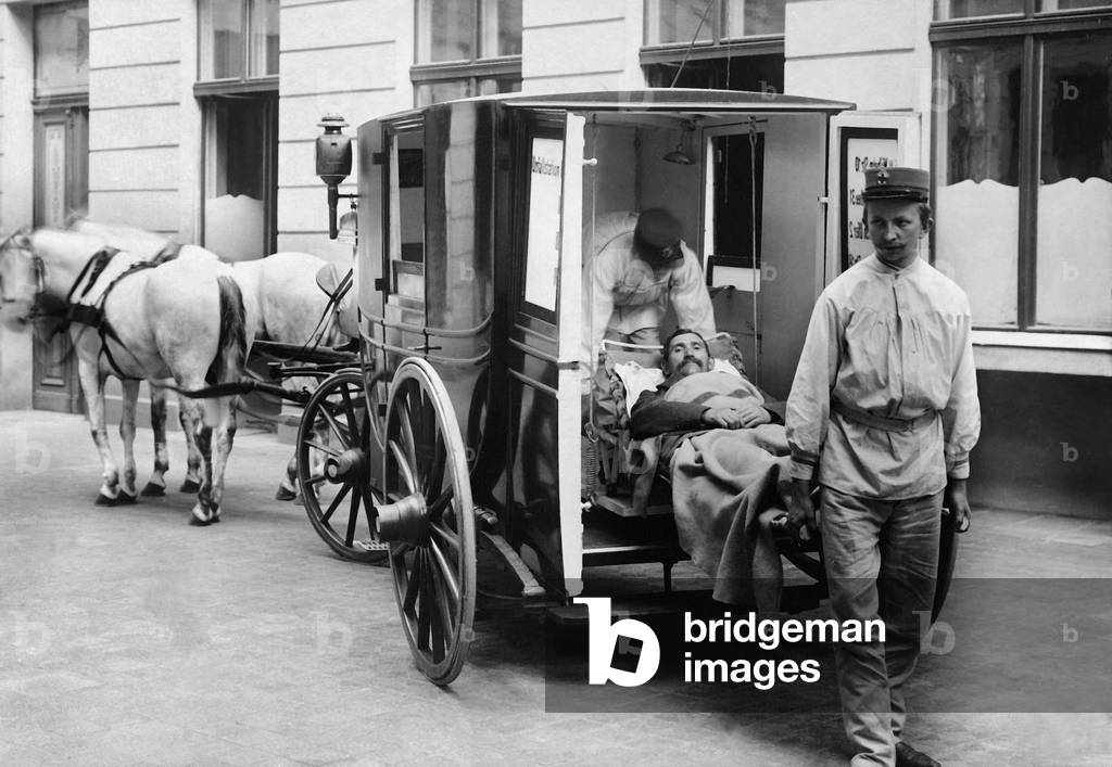 Ambulance service of the Red Cross with a accident victim, 1897 (b/w photo)