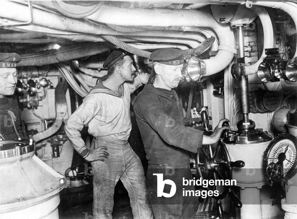 Helmsman in the headquarters of a German warship, 1916 (b/w photo)