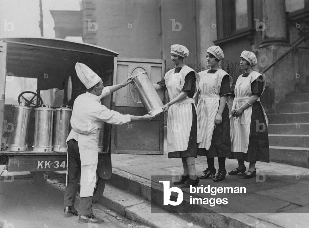 Servants take delivery of vacuum flasks, 1925 (b/w photo)