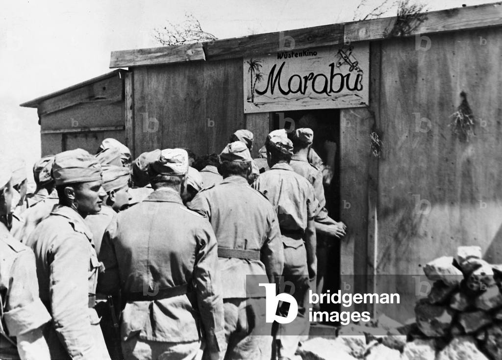German soldiers in front of a cinema, 1942 (b/w photo)