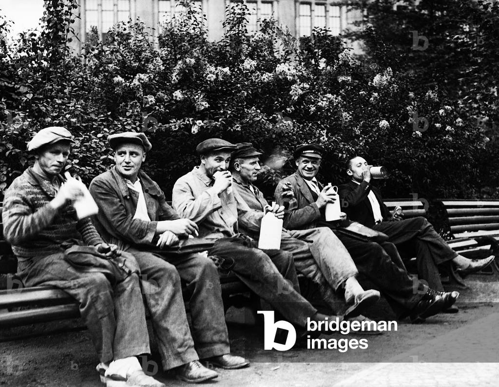 Workers during their breakfast time, 1938 (b/w photo)