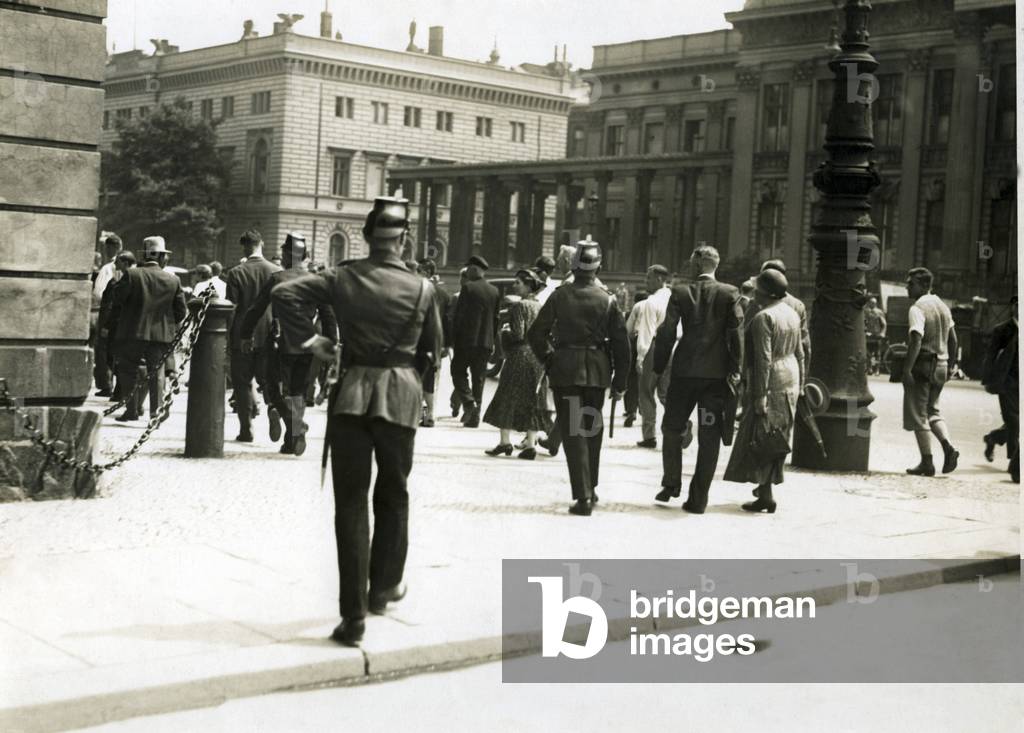 Police cleans the streets at the University of Berlin, 1931