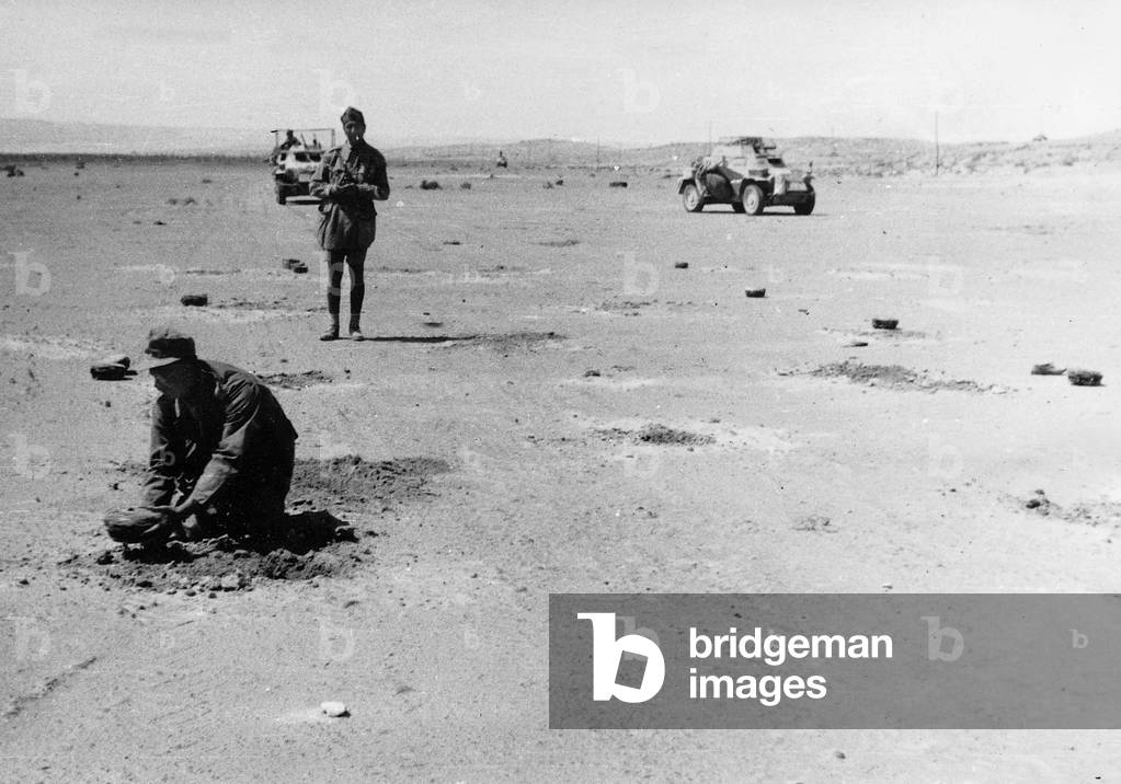 German soldiers lay mines, 1942 (b/w photo)