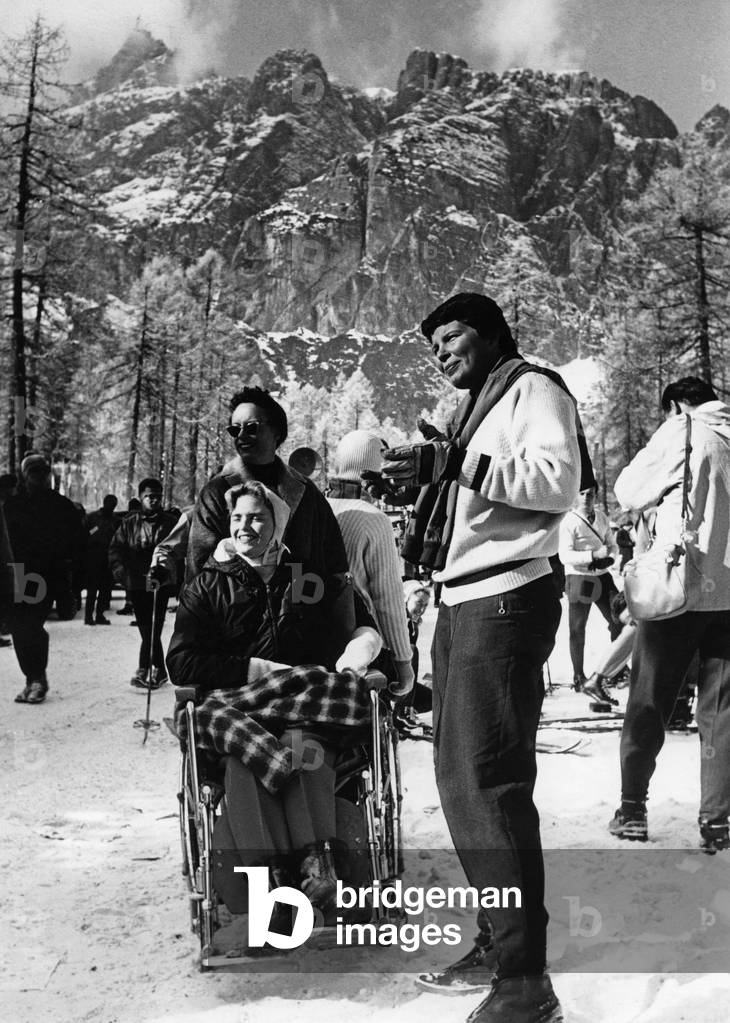 Visitors at the Winter Olympic Games, Cortina d'Ampezzo, Italy, 1956 (b/w photo)