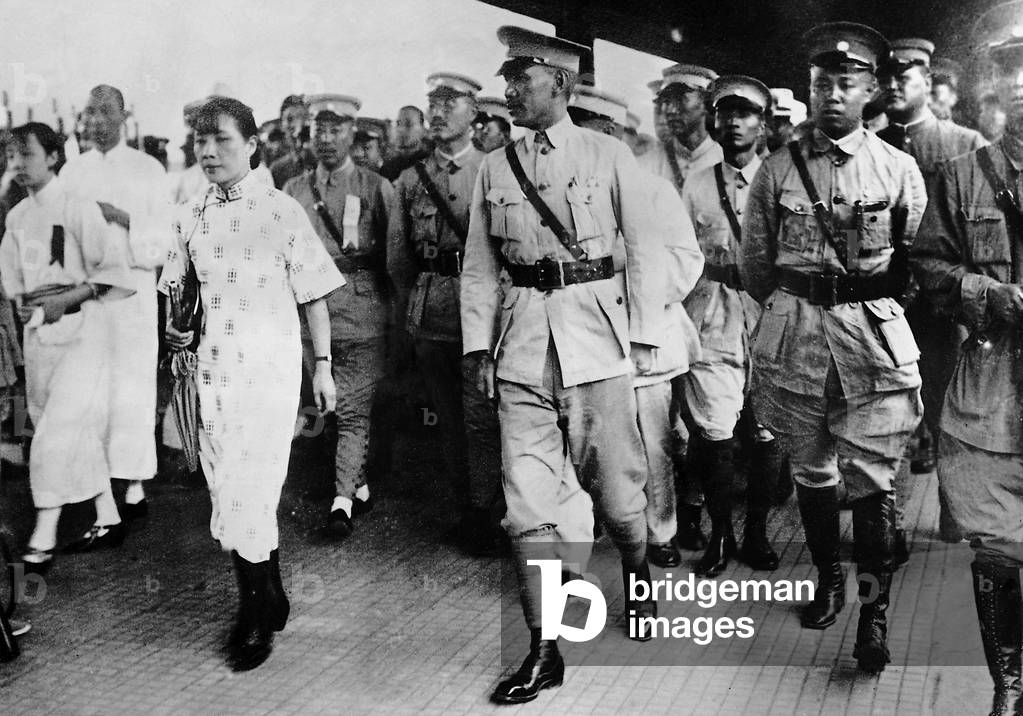 Chiang Kai-shek with wife and military escort, 1928 (b/w photo)