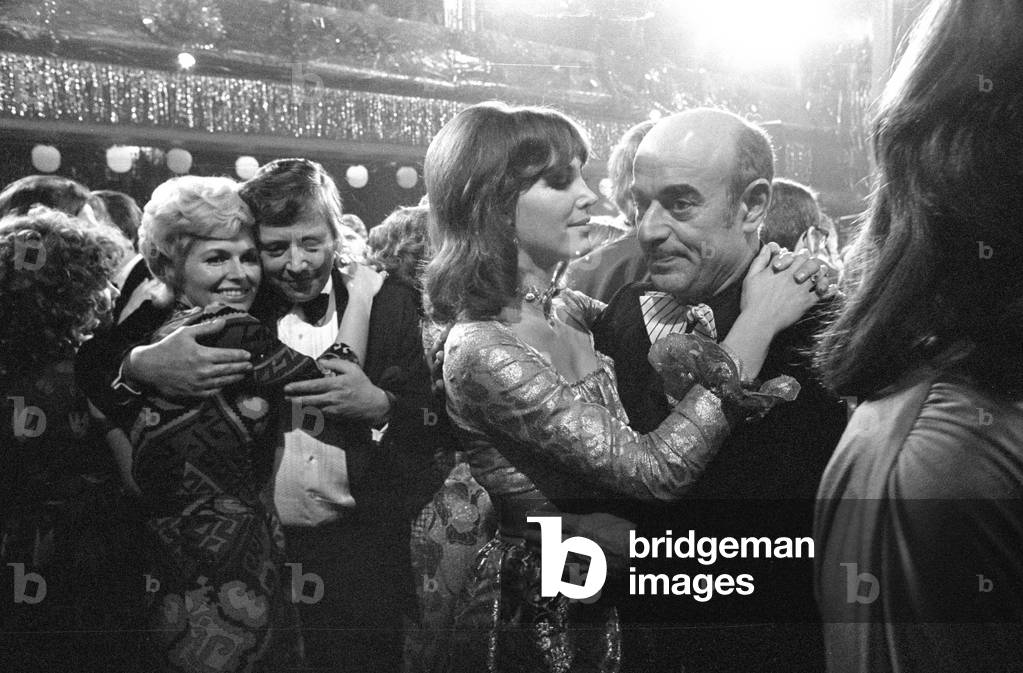 Gerhard Freund, Petra Schuermann and Artur Brauner at the German Film Ball in Munich, 1974 (b/w photo)