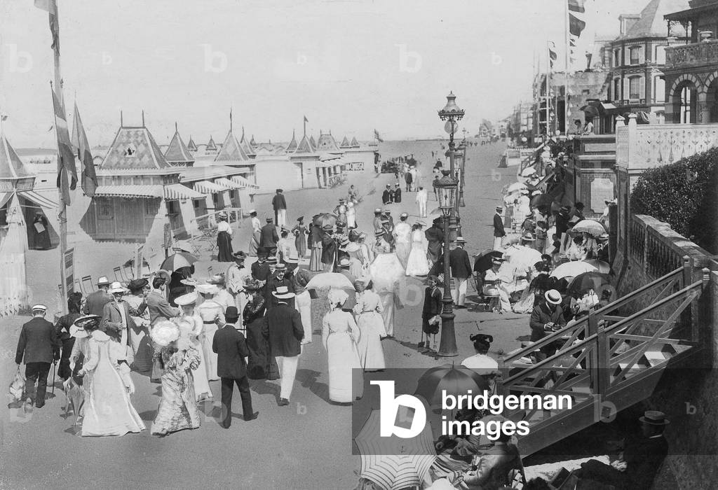 Trippers on the beach of Trouville in France, 1909 (b/w photo)