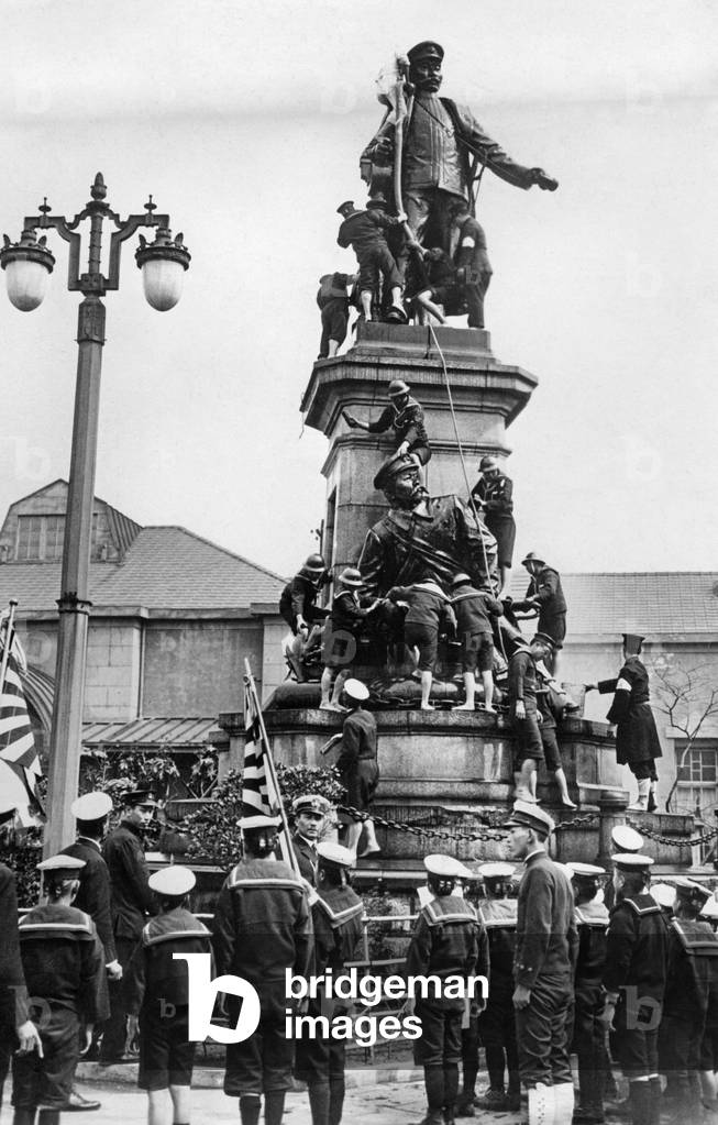 Japanese cadets cleaning a statue, 1932 (b/w photo)