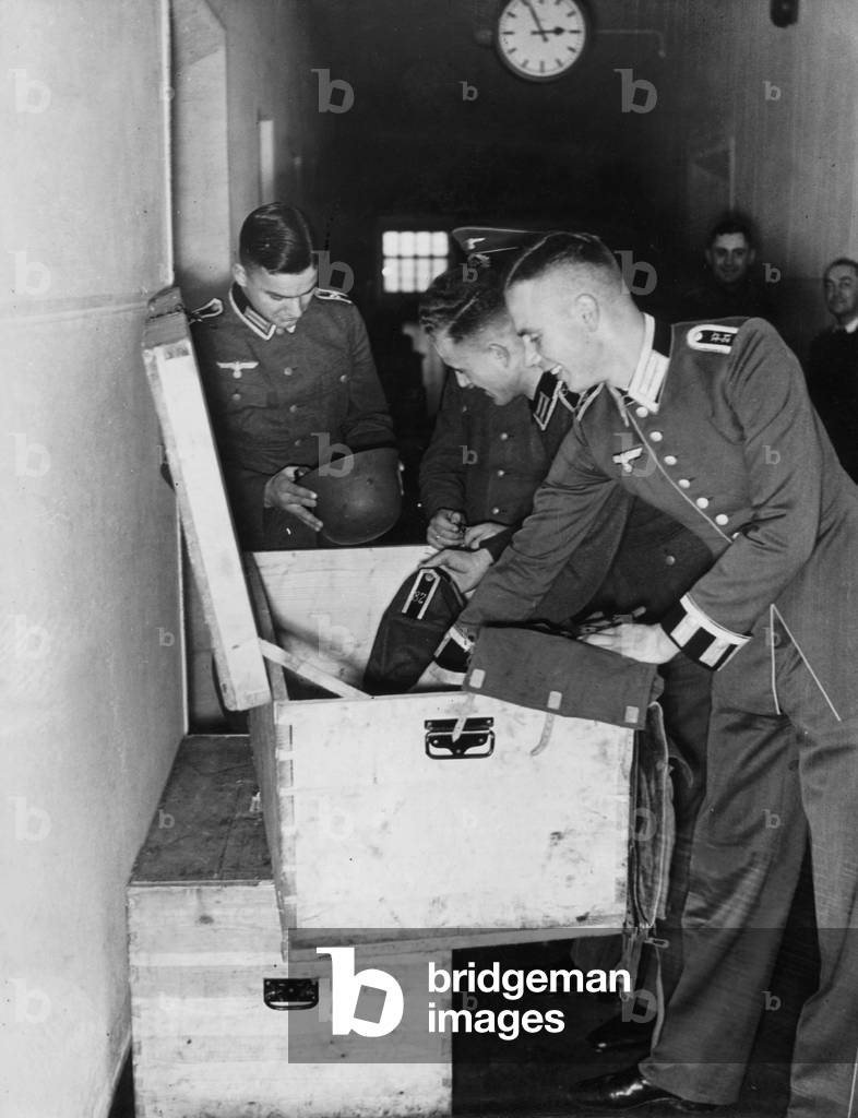 Non commissioned officers unpack cloth coffers, 1938 (b/w photo)