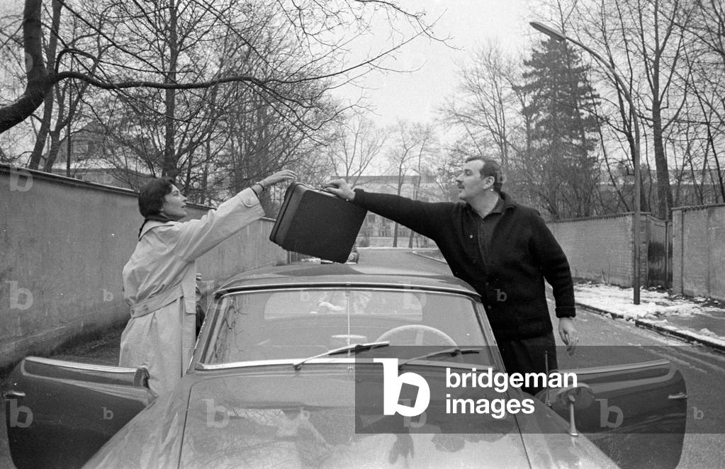 Bernhard Wicki and Agnes Fink at their sports car, 1959 (b/w photo)