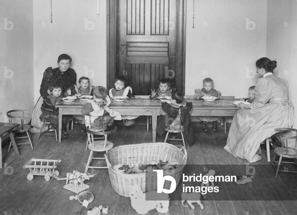 Kindergarten teachers with children, 1899 (b/w photo)