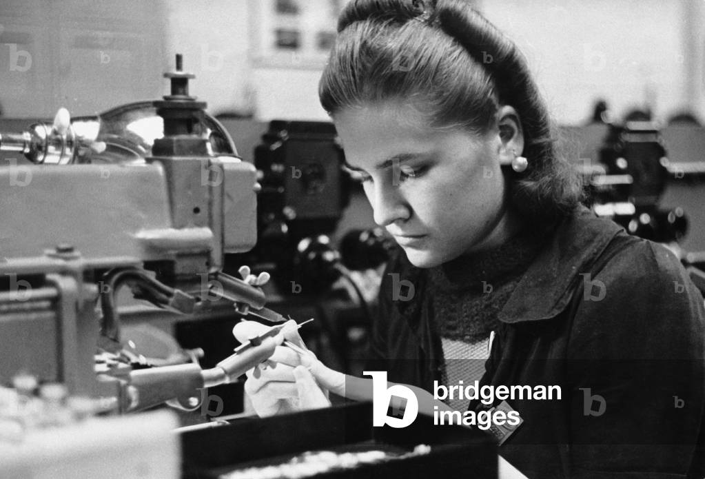 Woman in a German munitions factory, 1942 (b/w photo)