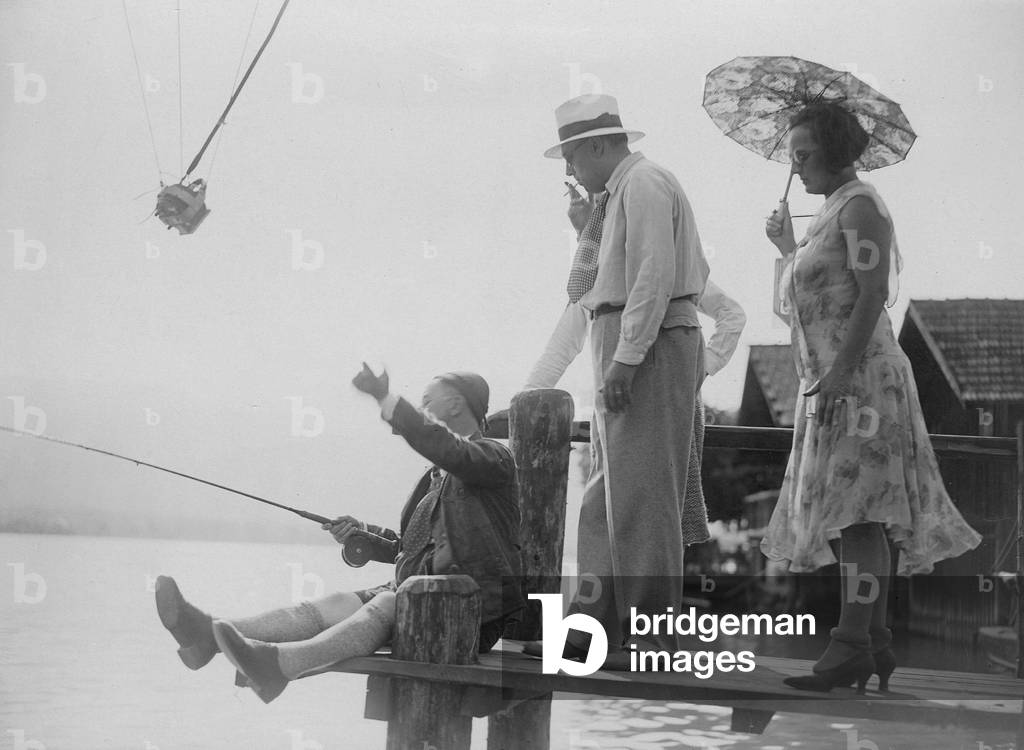 Hans Moser fishing, 1930 (b/w photo)