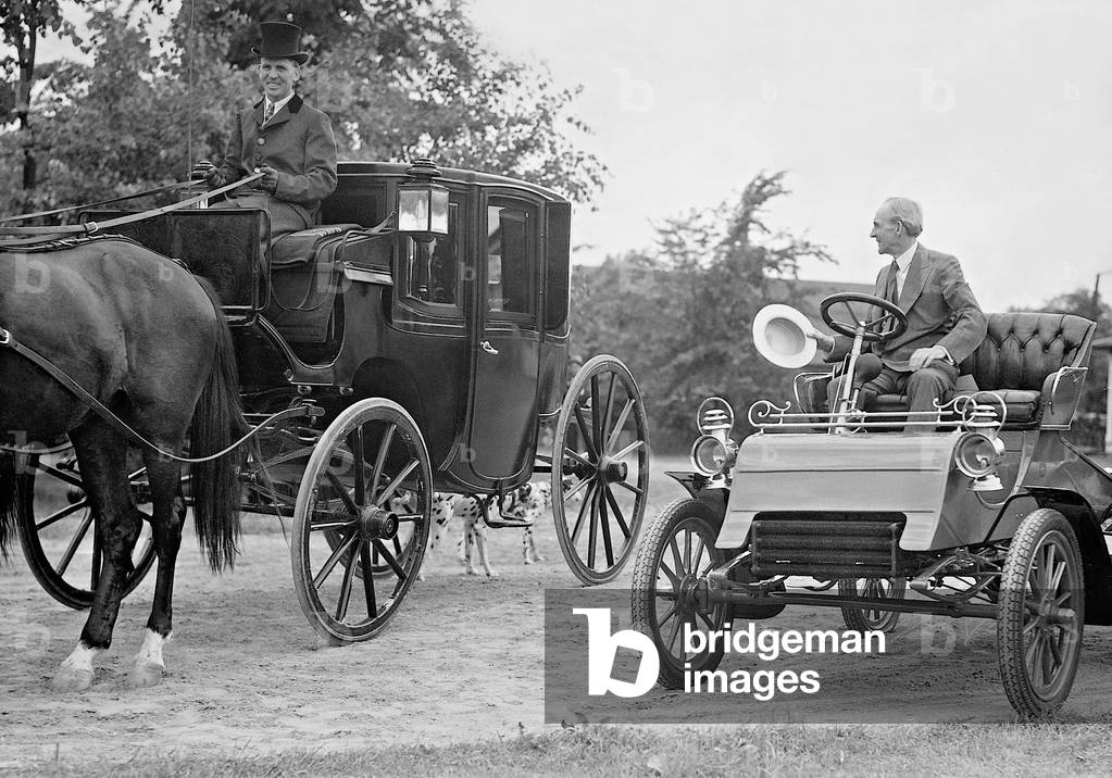 Henry Ford in an old Ford automobile, 1933 (b/w photo)
