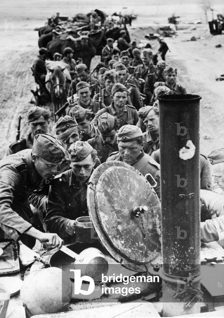 German soldiers in a field kitchen, 1941 (b/w photo)