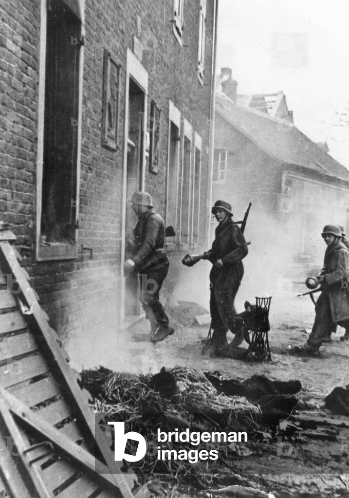 German soldiers in a village on the Western Front, 1945 (b/w photo)