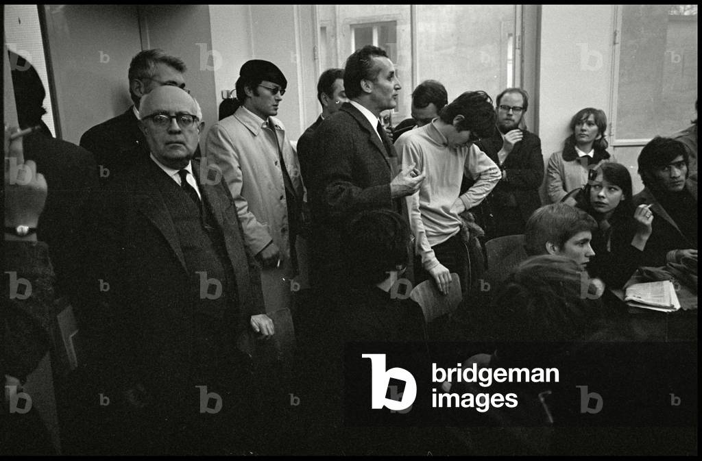 Theodor W. Adorno and Ludwig von Friedeburg talking to students, 1969 (b/w photo)