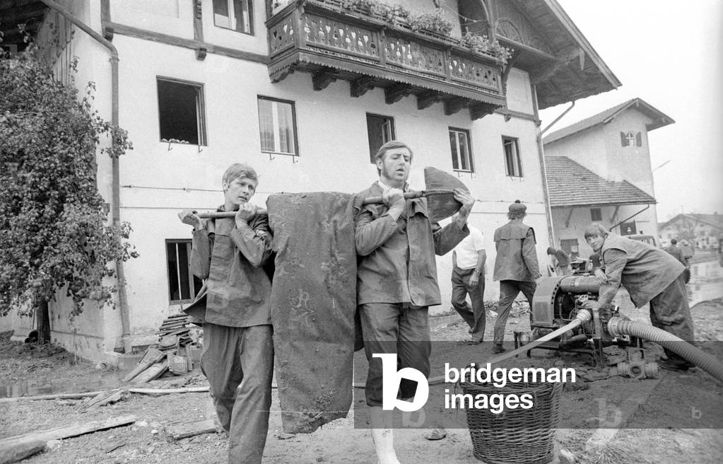 Cleaning up after a storm at Lake Chiemsee, 1974 (b/w photo)