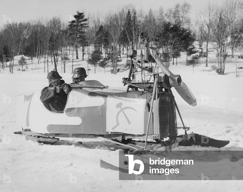 American National Guardsmen try out a motorized sled, 1940 (b/w photo)
