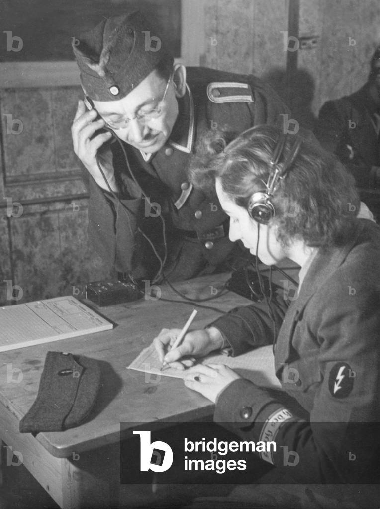 Instructor and 'Blitzmaedel' during radio training, 1943 (b/w photo)