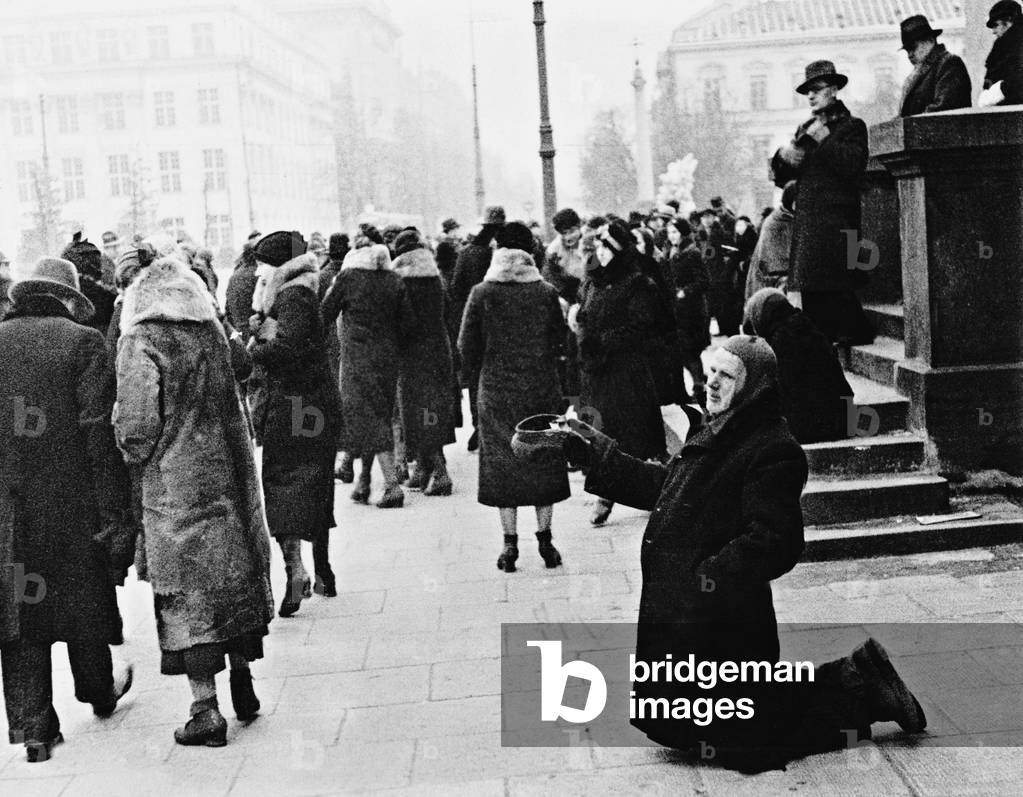 A beggar in Warsaw (b/w photo)