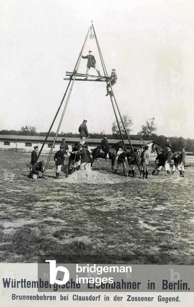 Railwayman drilling a well, 1913 (b/w photo)