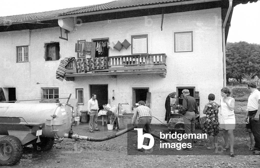 Cleaning up after a storm at Lake Chiemsee, 1974 (b/w photo)