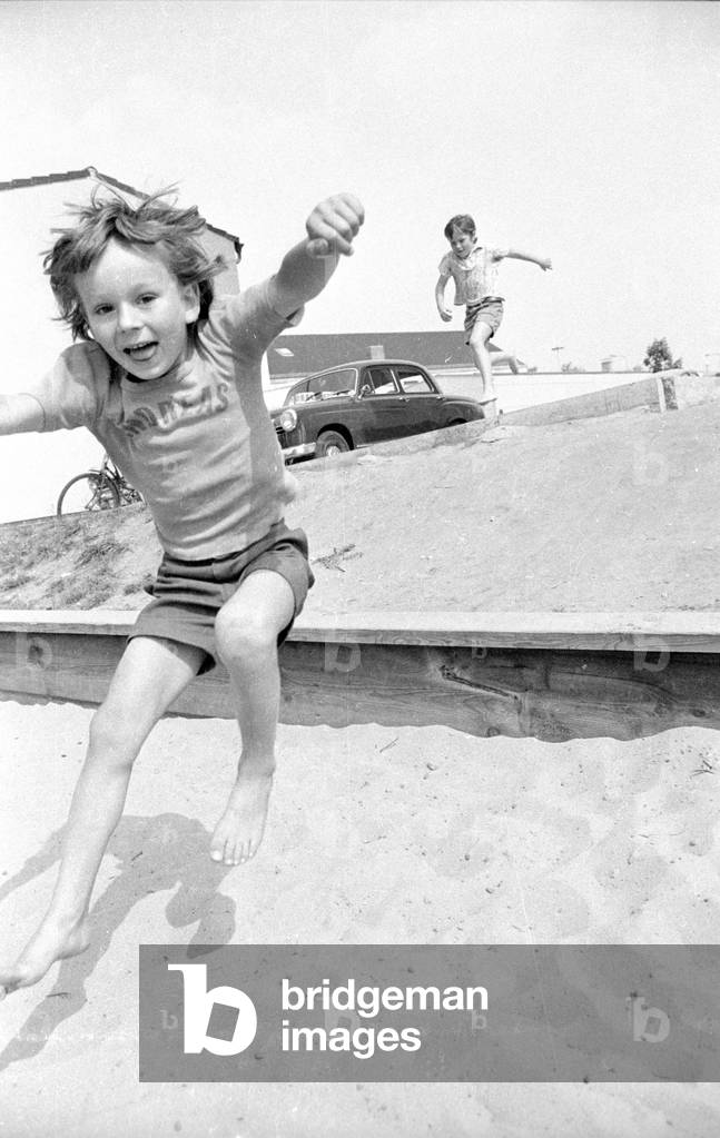 Child playing,1974 (b/w photo)