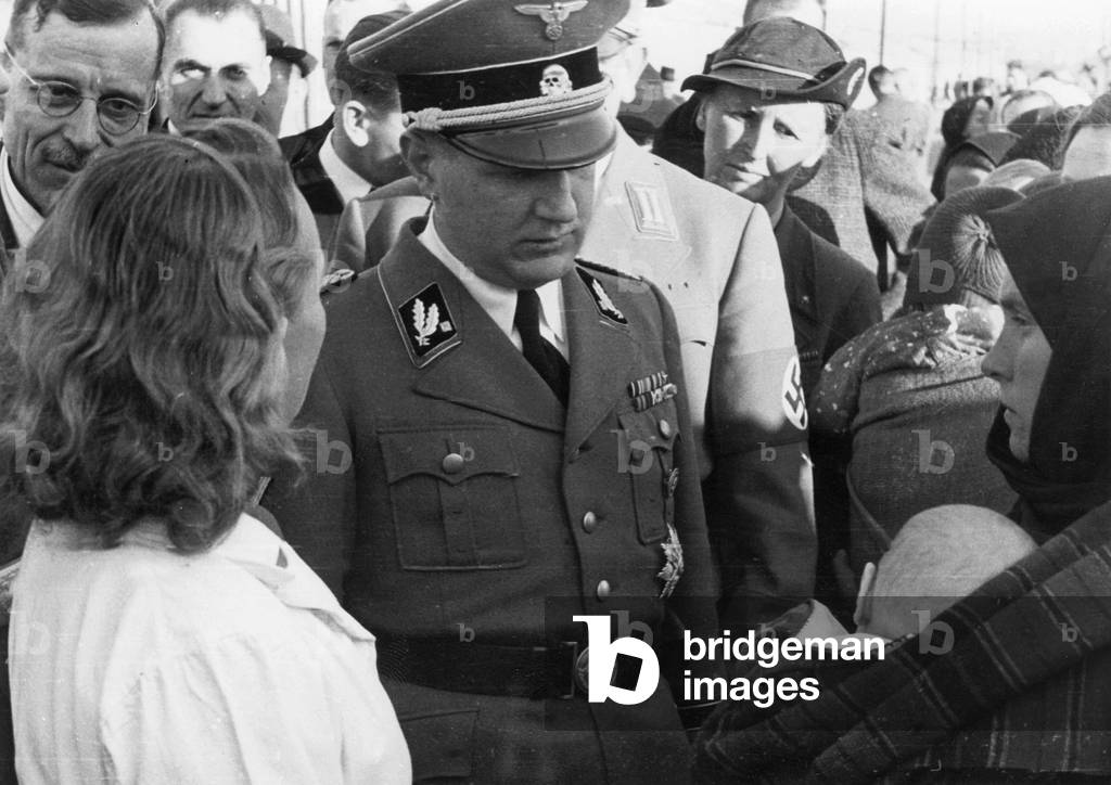 Reich Health leader Leonardo Conti with German-Russians, 1940 (b/w photo)