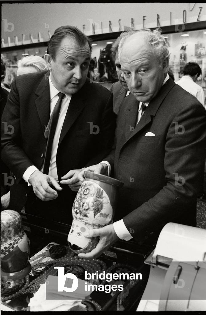 Walter Scheel and Hans-Dietrich Genscher looking at Matryoshka dolls, 1969 (b/w photo)