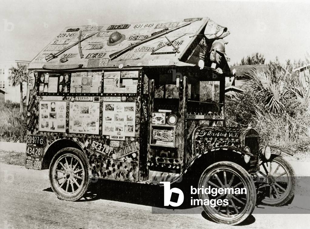 Automobile with souvenirs (b/w photo)
