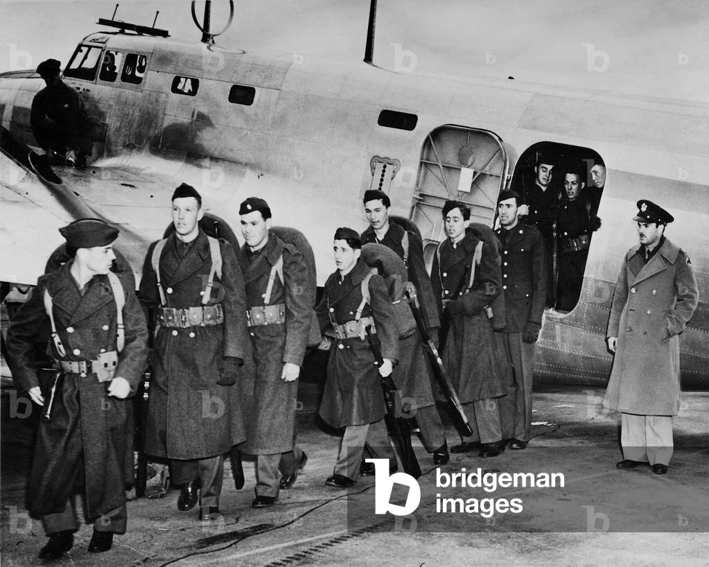 U.S. military and equipment is being transported by aircrafts, 1940 (b/w photo)