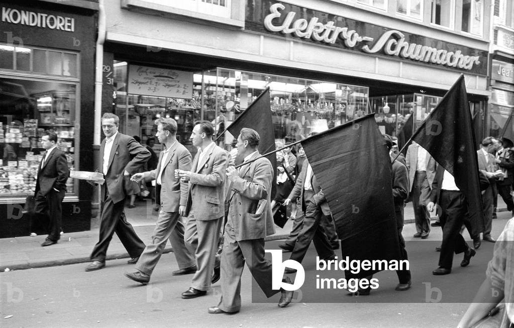 Miners on the road through Dusseldorf, 1959 (b/w photo)