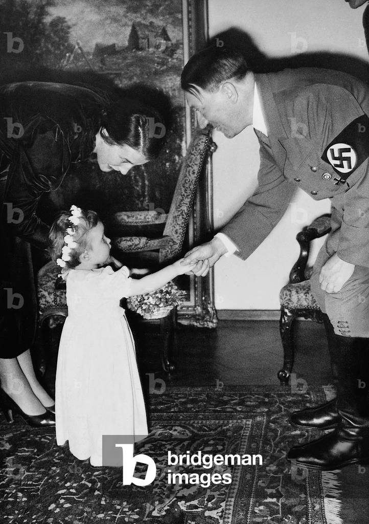 Girl congratulates Adolf Hitler for his birthday, 1937 (b/w photo)