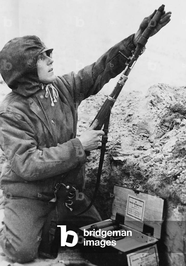 German soldier with a rifle grenade in WWII on the Eastern front, 1944 (b/w photo)