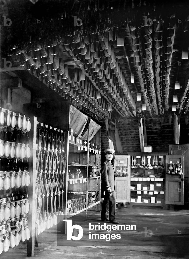 German supply sergeant in the clothing room, 1910 (b/w photo)
