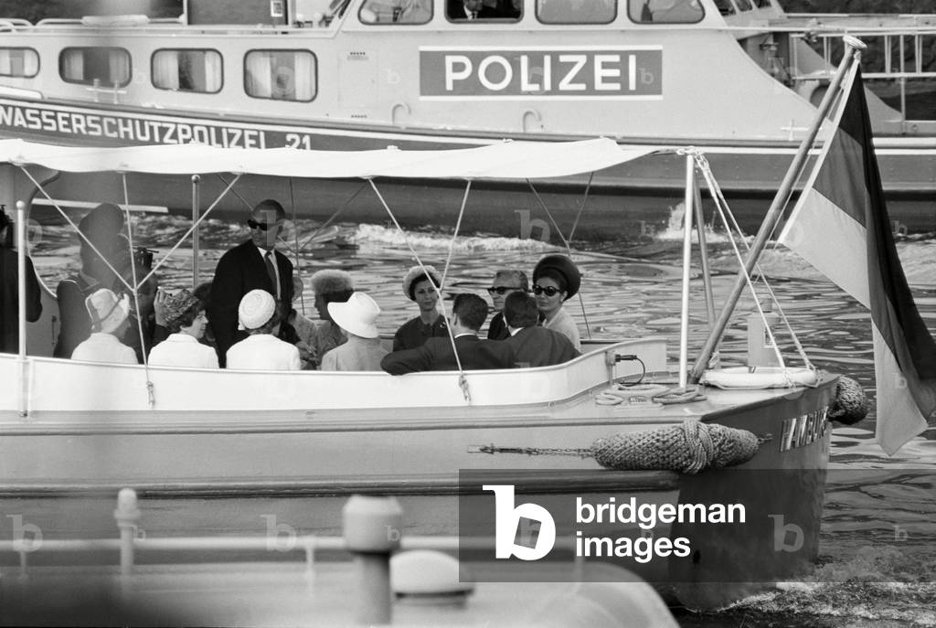 Shah Mohammad and his wife Farah Diba during a tour of the Hamburg harbour, 1967 (b/w photo)
