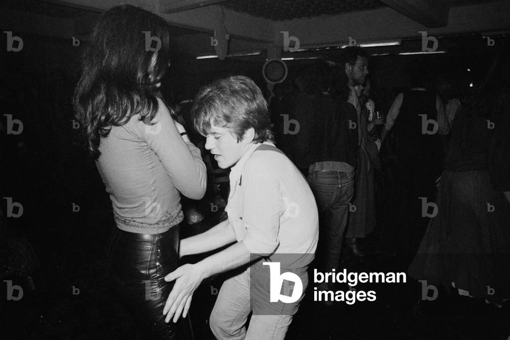 Dancers in a disco (b/w photo)