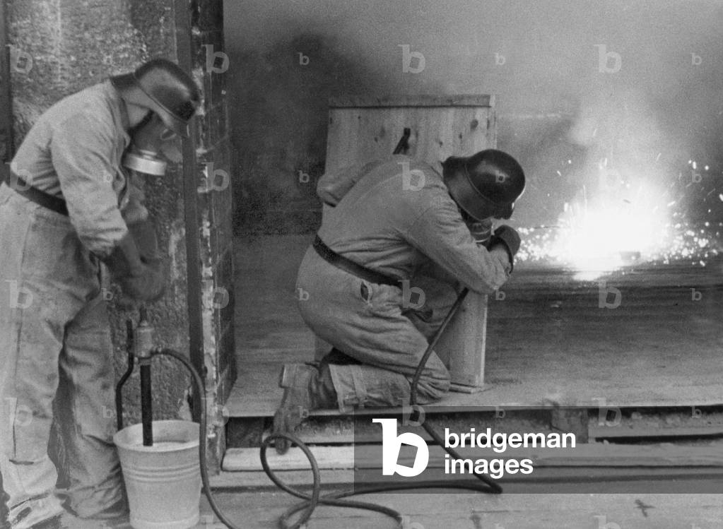 Training for extinguishing a fire bomb, 1941 (b/w photo)
