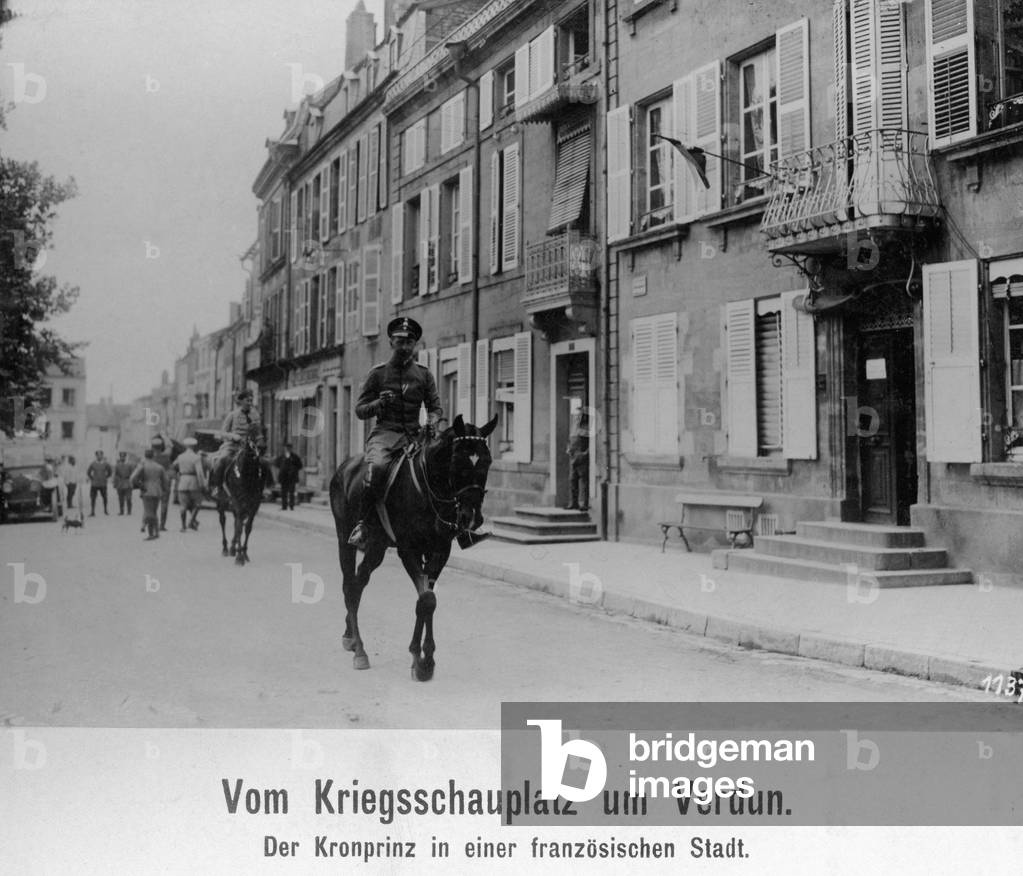 Crown Prince Wilhelm rides through a French village, 1916  (b/w photo)