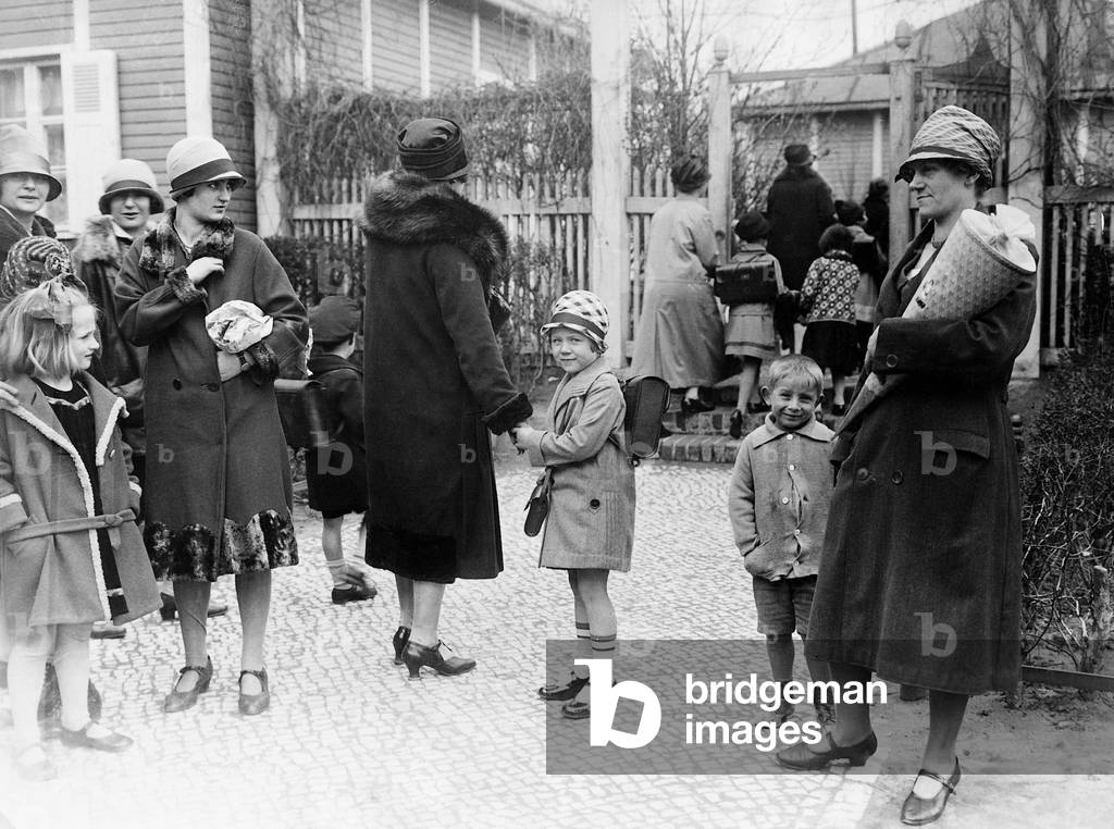Parents and children on the first day of school (b/w photo)