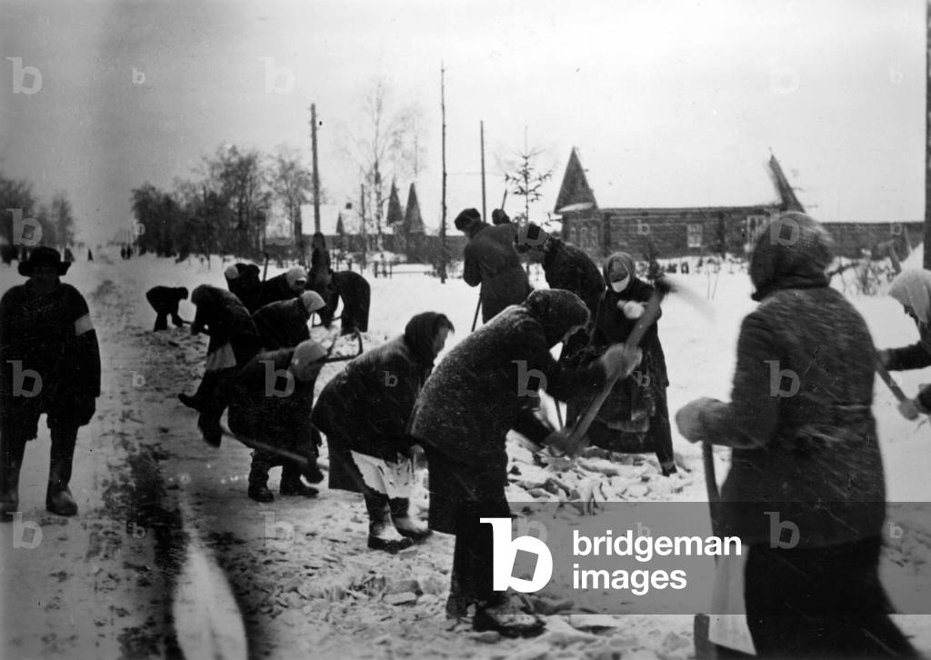 Russian forced laborers clear a road, 1942 (b/w photo)