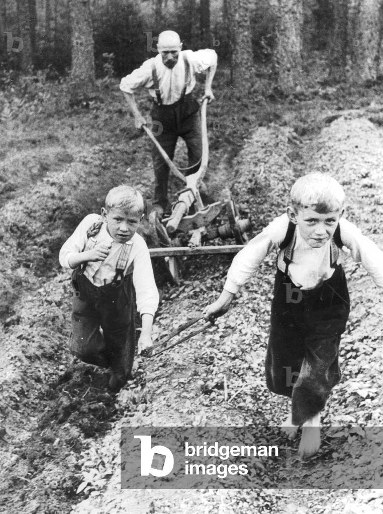 Children plow, 1936 (b/w photo)