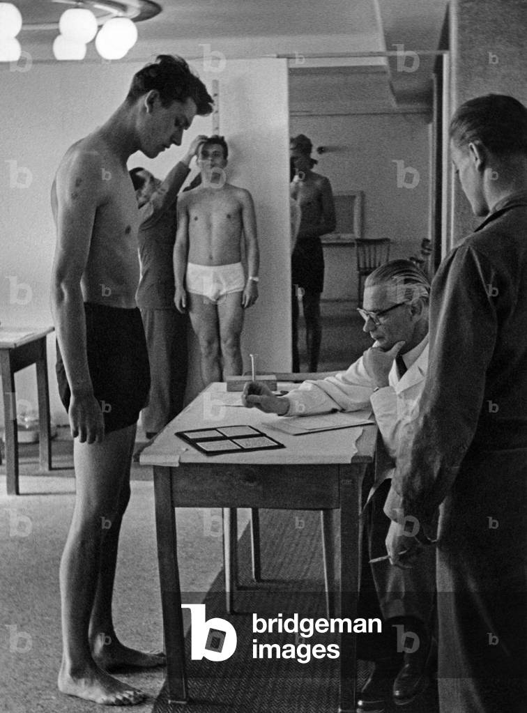 Medical examination for military service, 1950s (b/w photo)