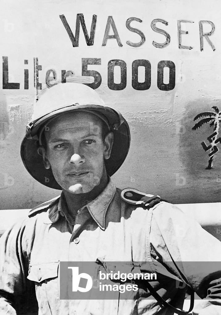 Transport leader in front of a water tank, 1942 (b/w photo)